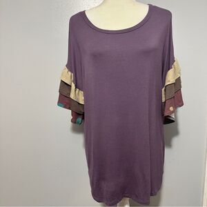 Celeste purple ruffle sleeves with polka dots. Size L